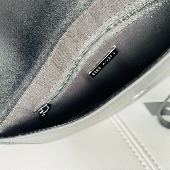 New With Tags
BCBG Pearl + Leather Inspired
Envelope Clutch in
BLACK - Picture 15 of 15